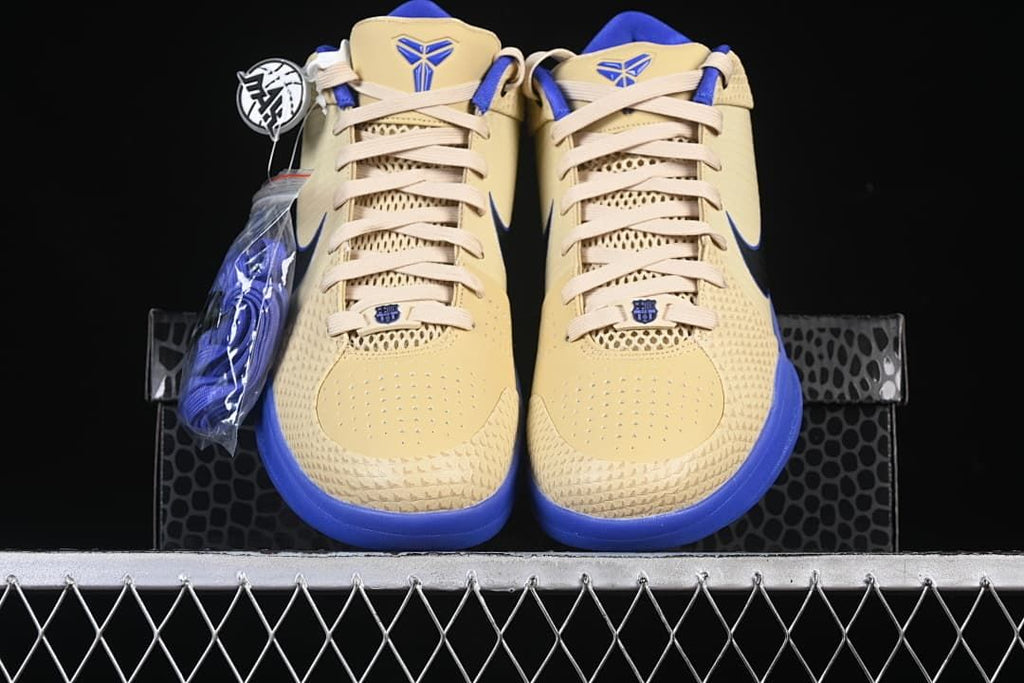 Front view of the pair showing the cream uppers and blue accents.