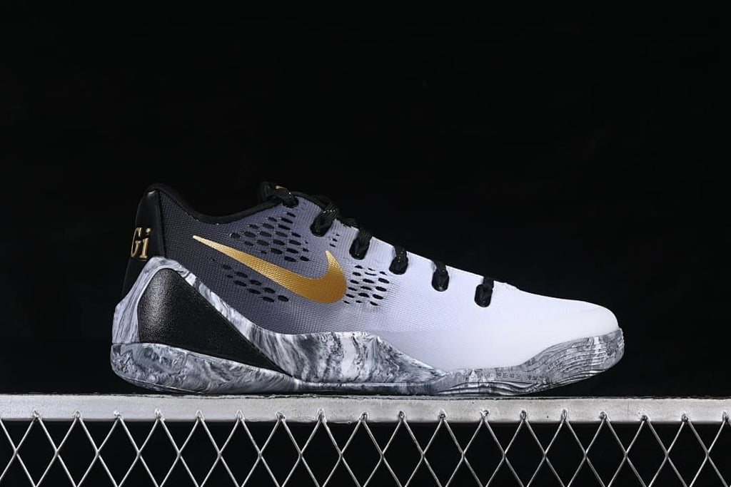 Side profile showing the white and gray upper and gold Swoosh