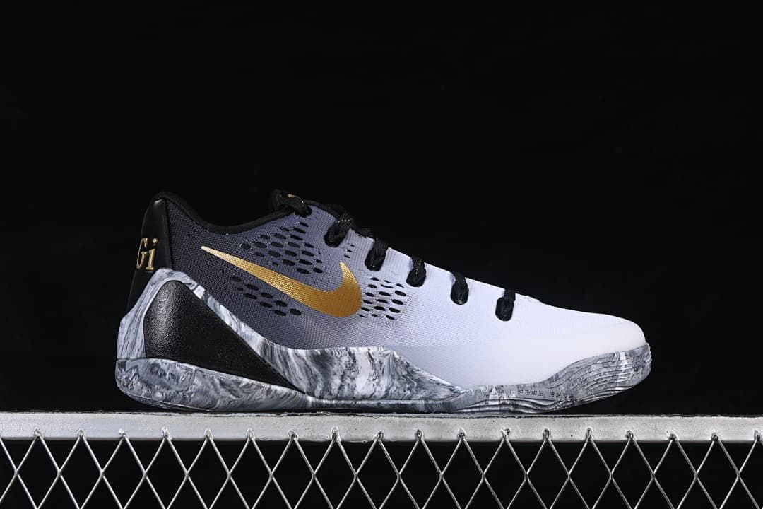 Side profile showing the white and gray upper and gold Swoosh
