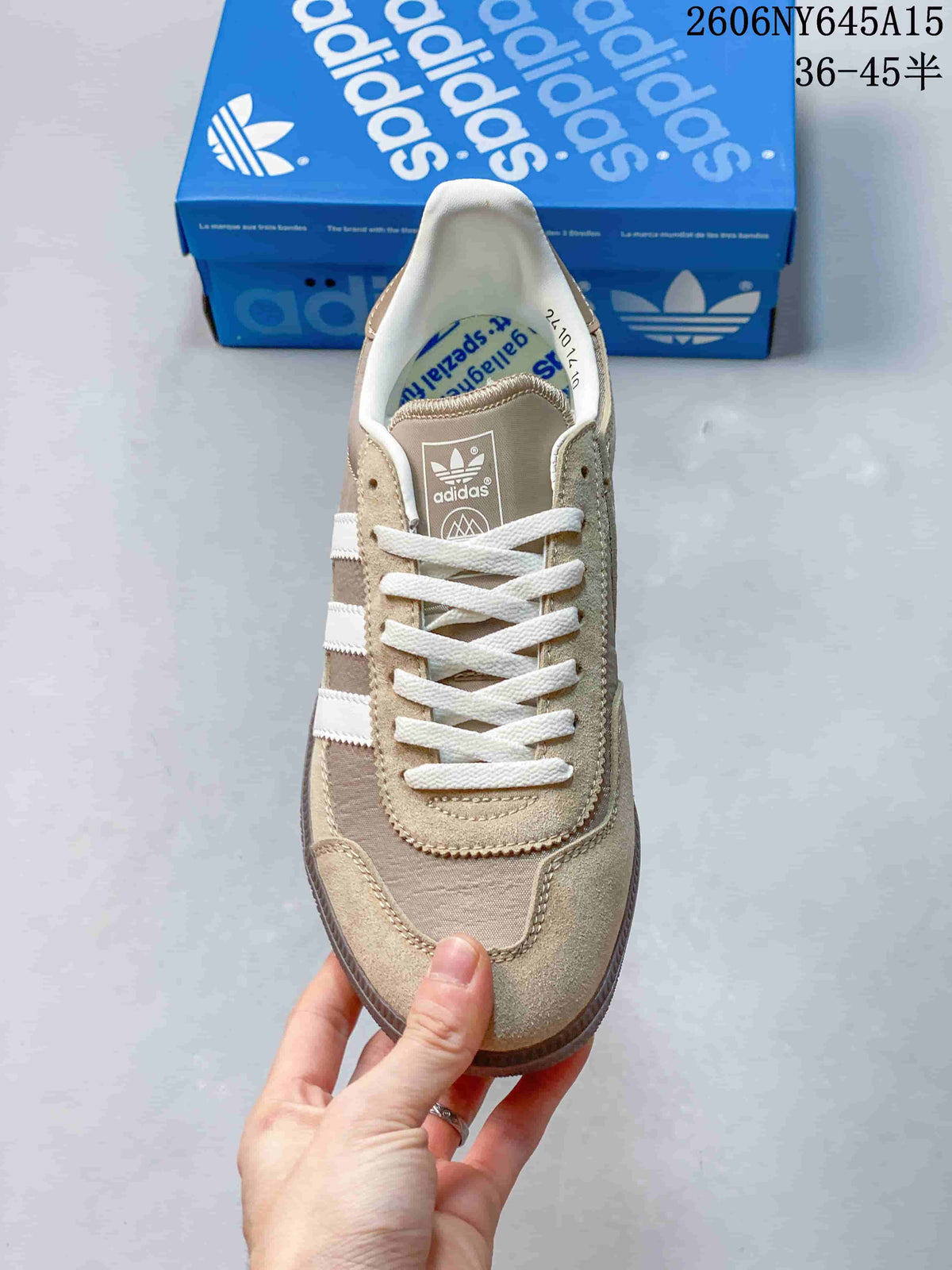 Top view of the taupe sneaker showing its lacing, toe panels and white side stripes.