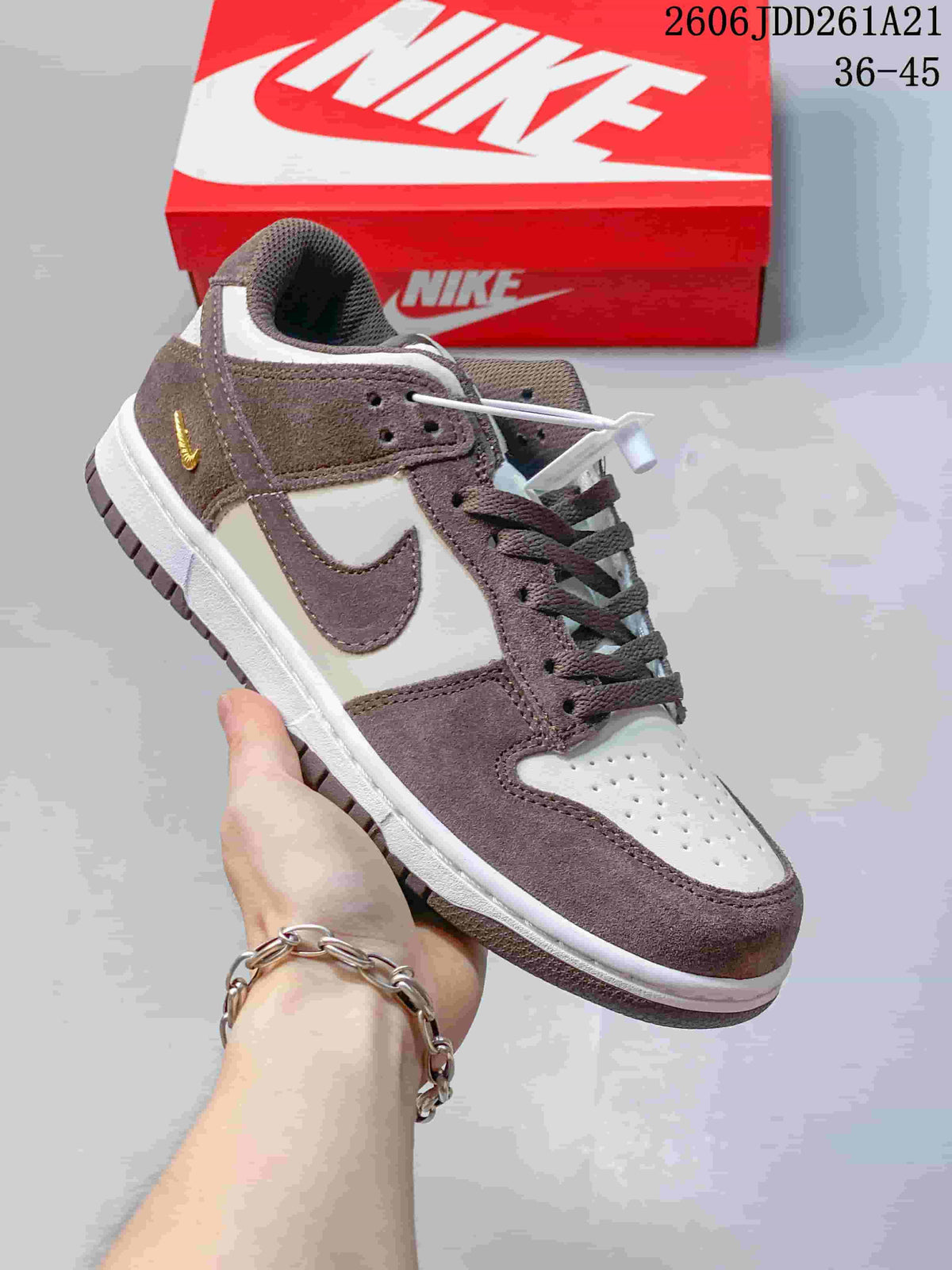Brown and cream low-top Nike Dunk sneaker with coordinating laces