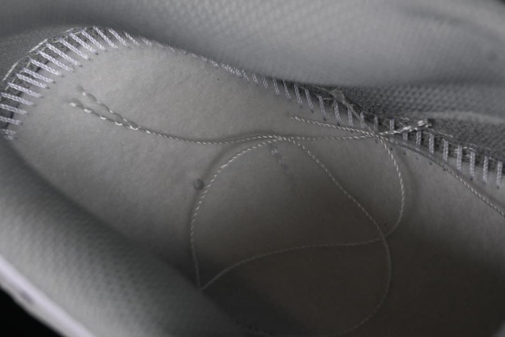 Close-up view inside the sneaker showing stitching and lining