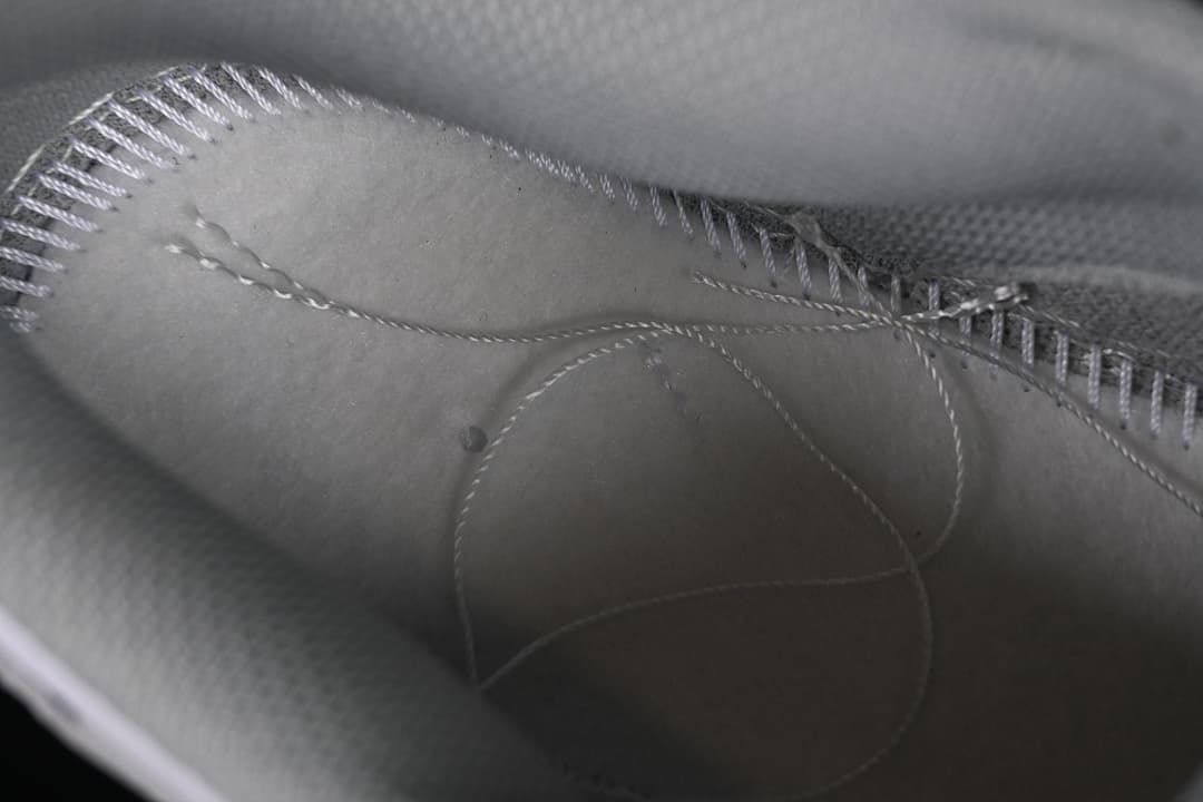 Close-up view inside the sneaker showing stitching and lining