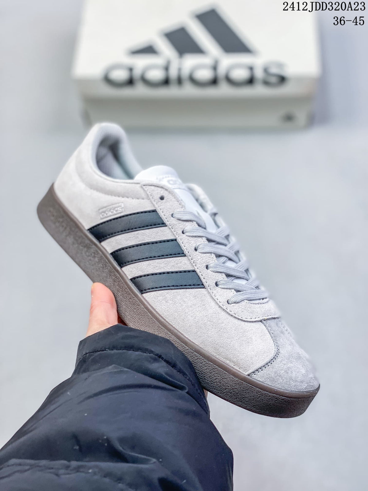 Angled side view of the light grey Adidas VL Court Classic sneaker