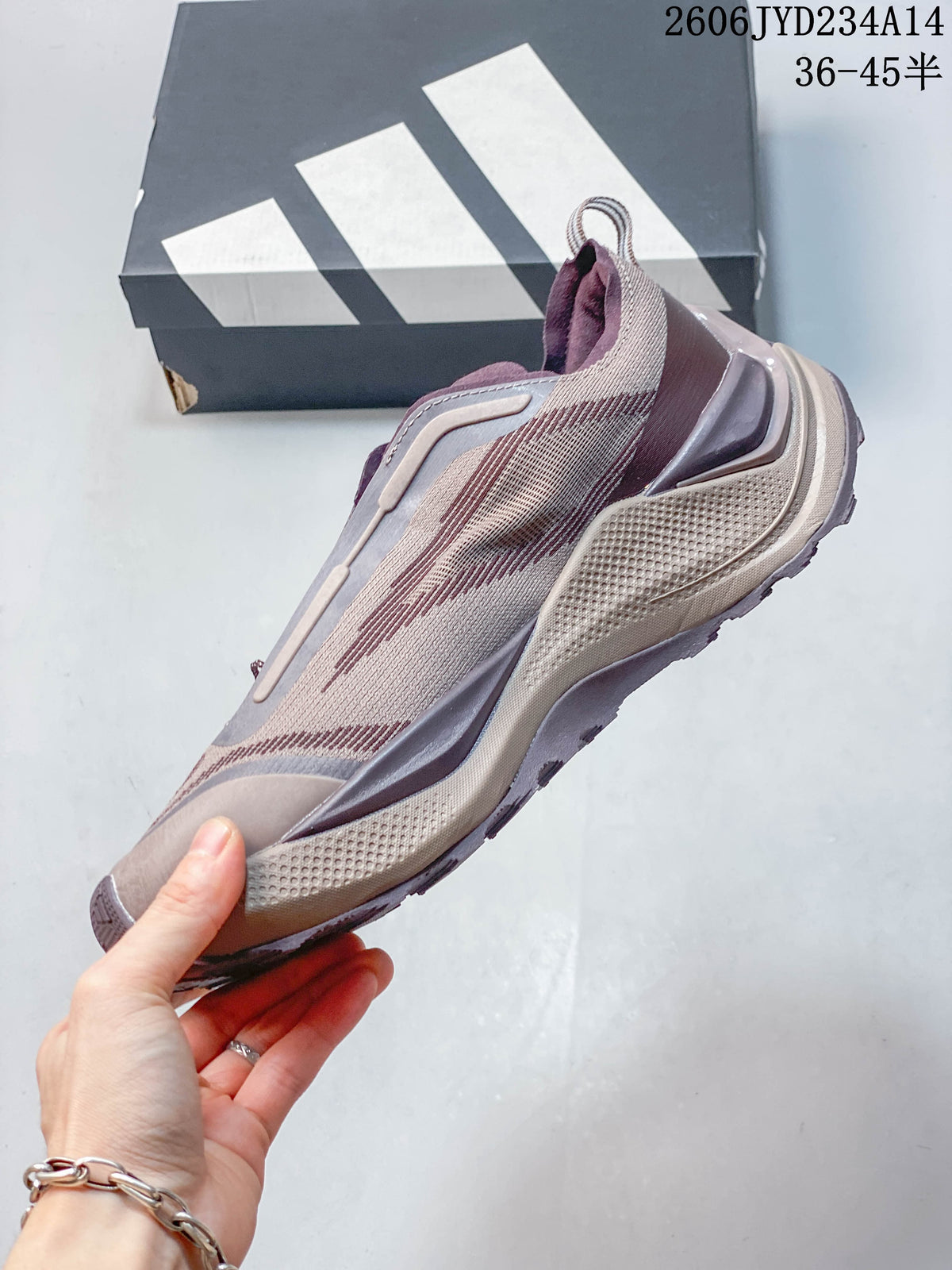 Side profile showing the patterned upper and sculpted panels of the Adidas Holo Peak