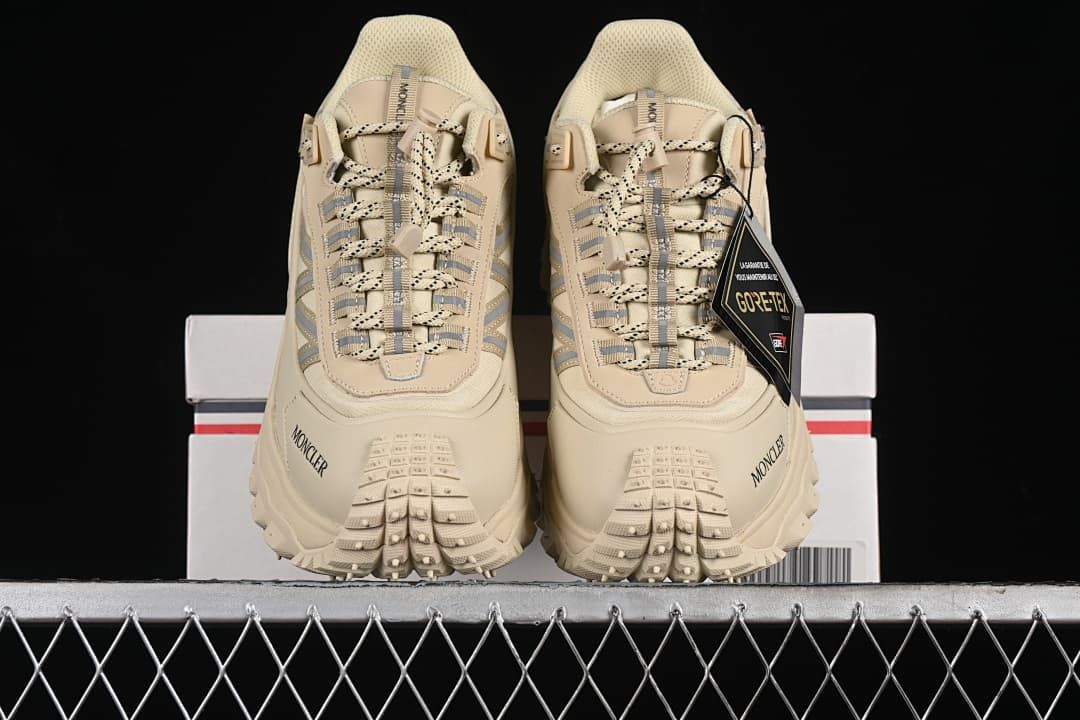 Front view of the pair showing the laces and toe tread.