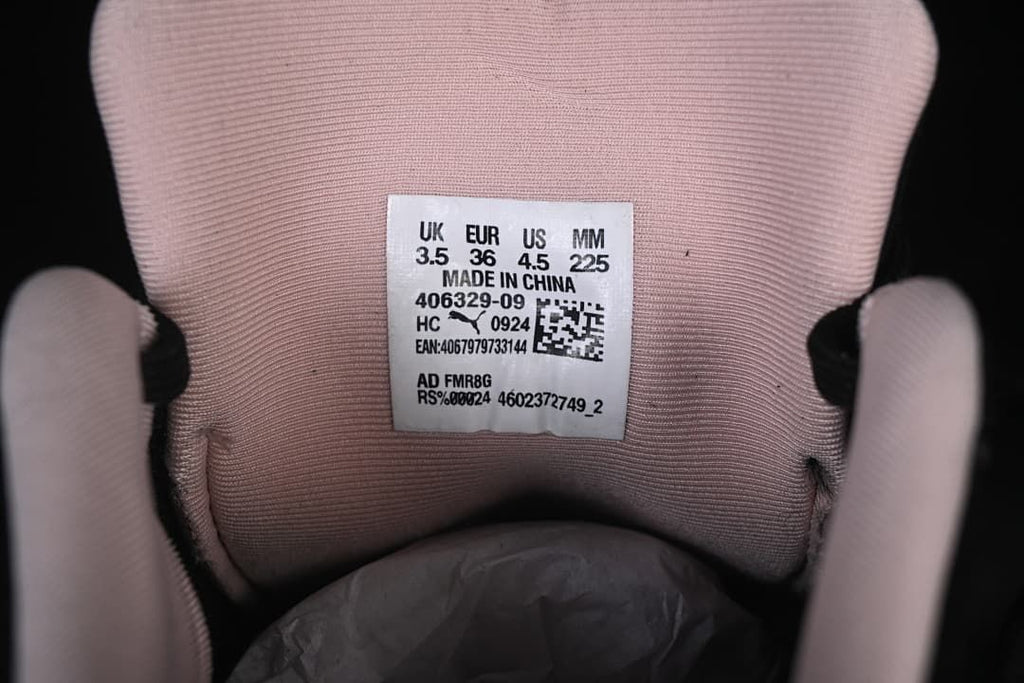 Inside shoe label showing UK, EUR, US, and millimeter sample sizing and style code.
