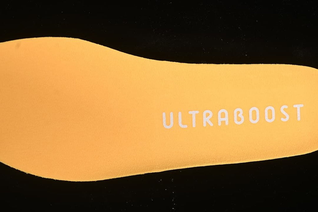 Close-up of the orange insole marked Ultraboost