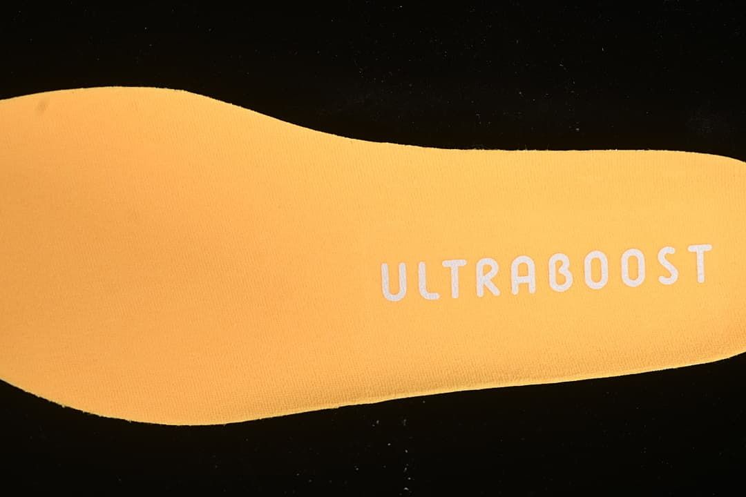 Close-up of the orange insole marked Ultraboost
