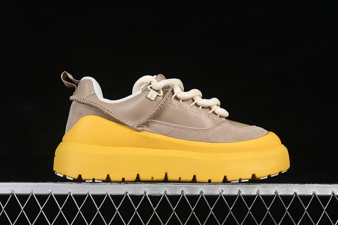 Side profile of the taupe sneaker with a thick yellow sole