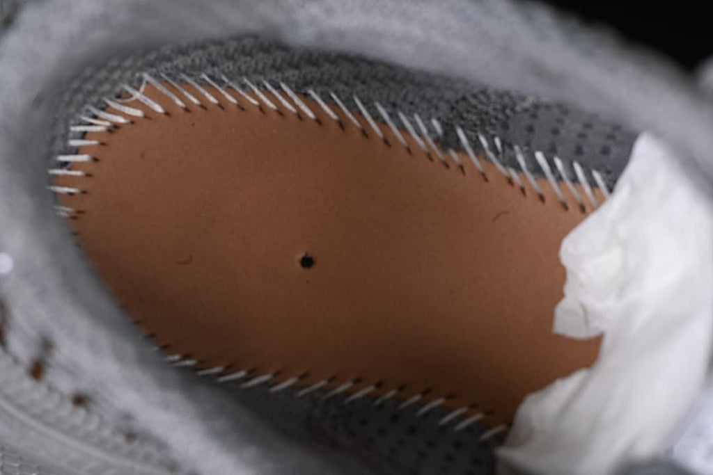 Close-up inside the shoe showing the footbed and stitched edge.