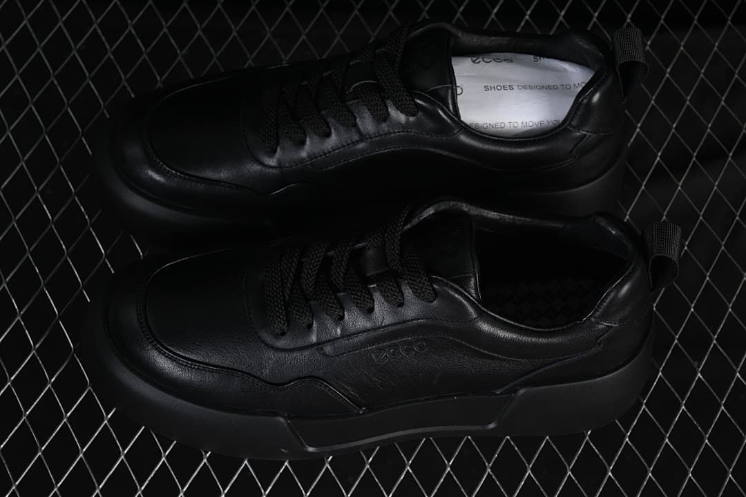 Pair of black sneakers shown from above at an angle