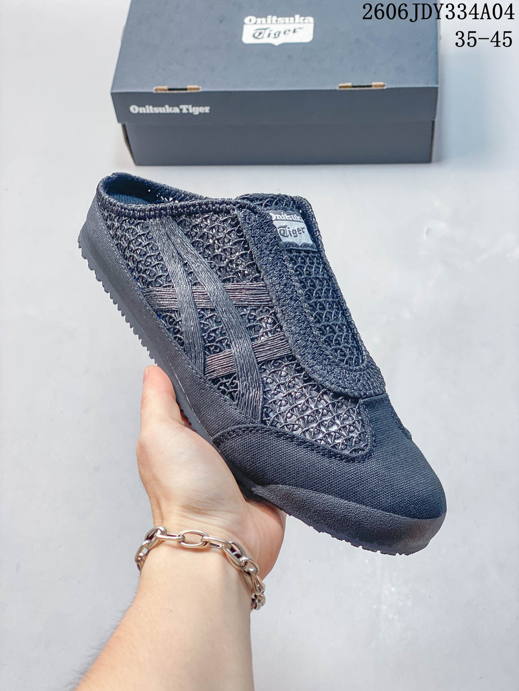 Dark navy Onitsuka Tiger Mexico 66 Sabot shoe shown from the side, with patterned upper and matching stripes.
