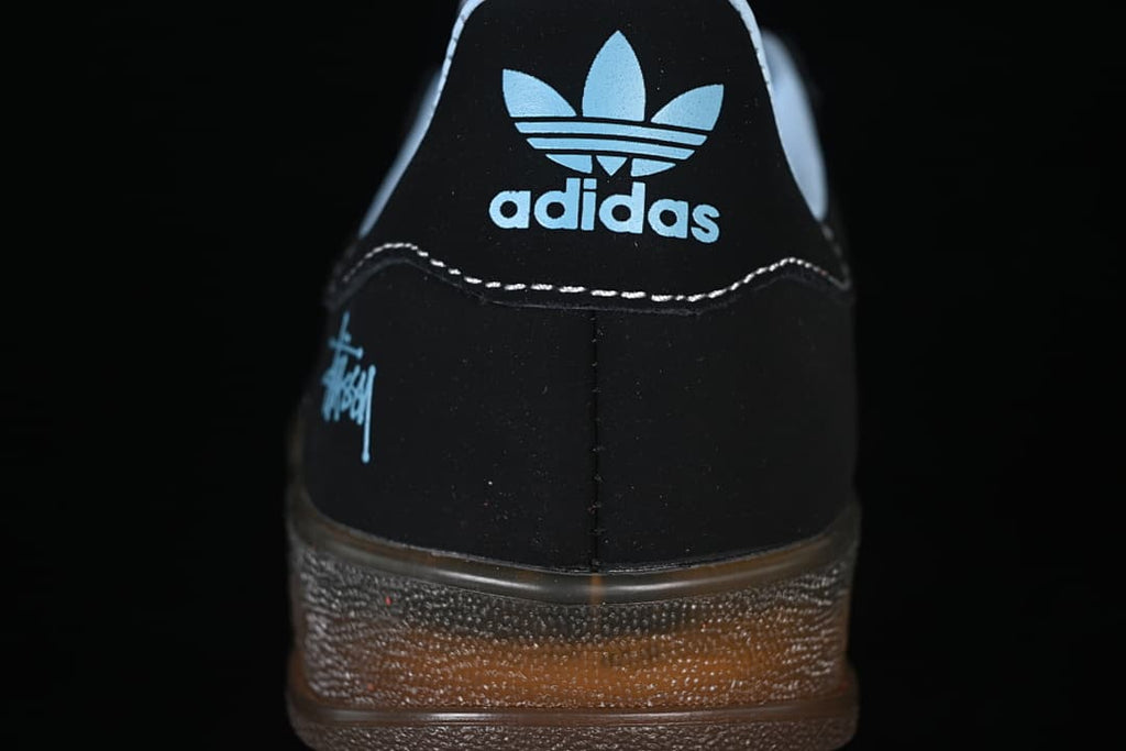 Rear view of the sneaker showing the heel branding and gum-colored sole