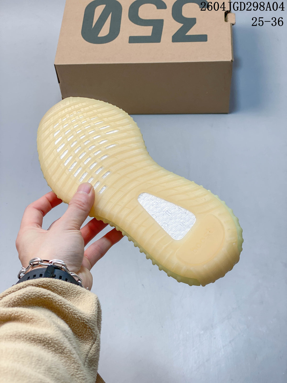 Close-up of the sneaker’s translucent pale-yellow ribbed outsole.