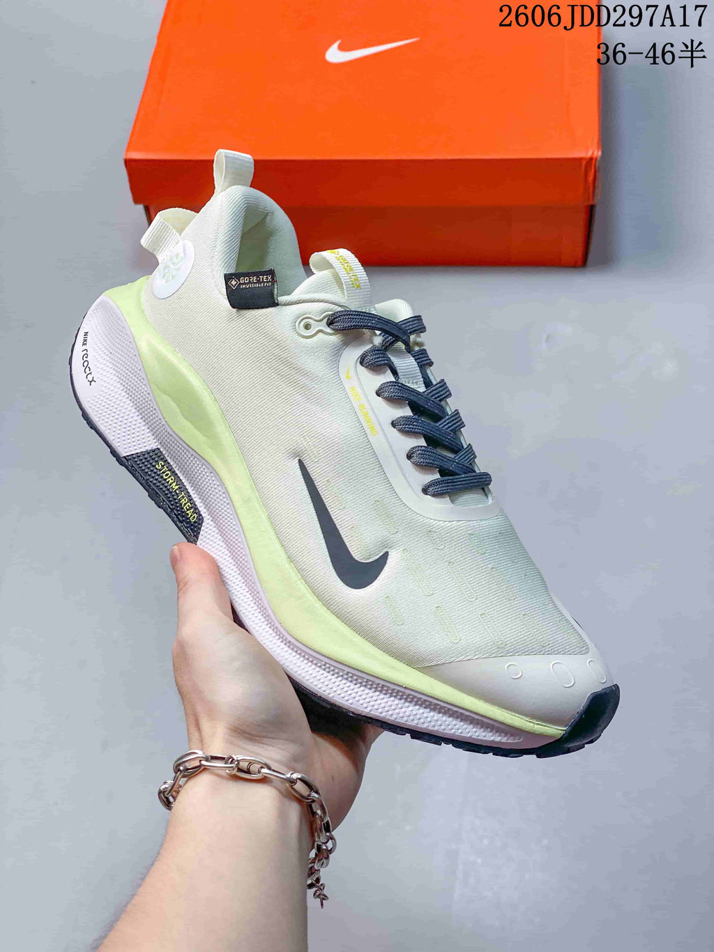 Side view of a Nike InfinityRN 4 shoe with pale white upper and lime accents