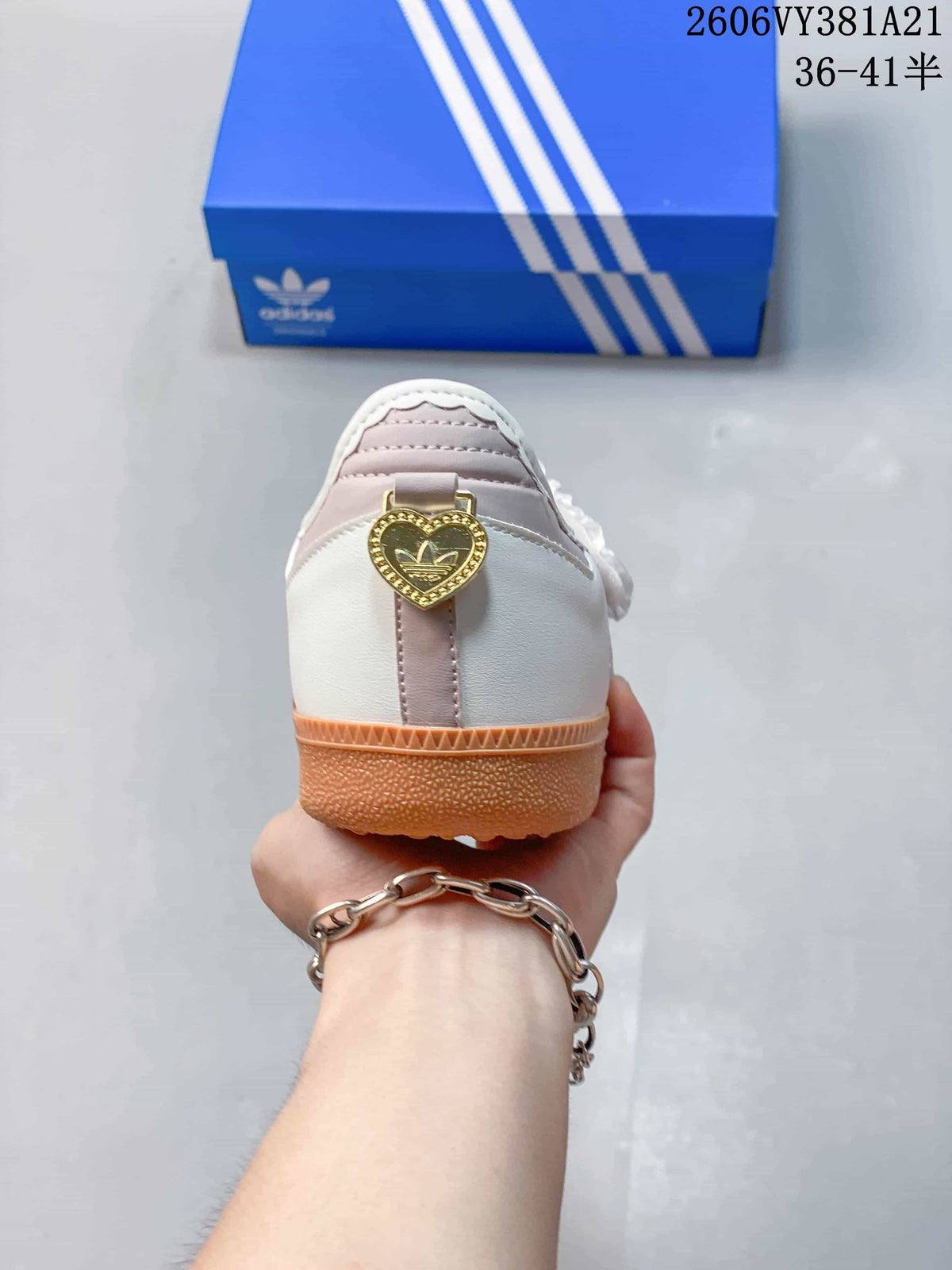 Rear view showing a gold-tone heart-shaped heel detail
