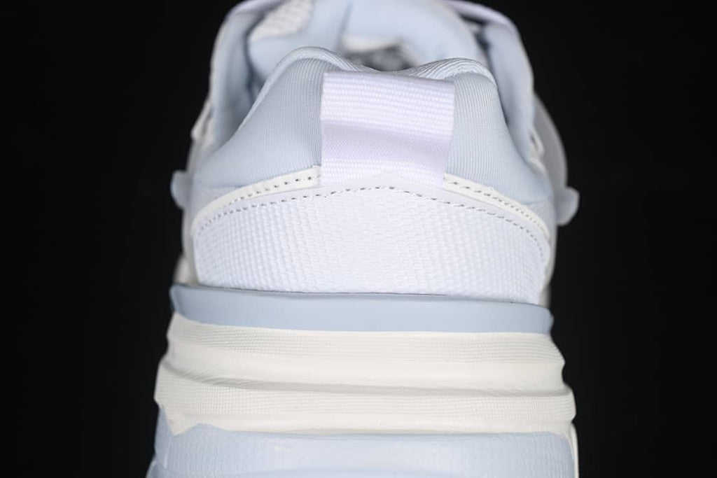 Rear view showing the sneaker heel, pull loop, and layered sole