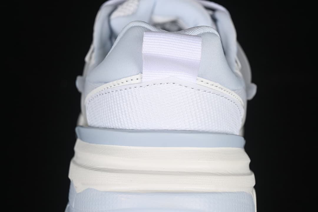 Rear view showing the sneaker heel, pull loop, and layered sole