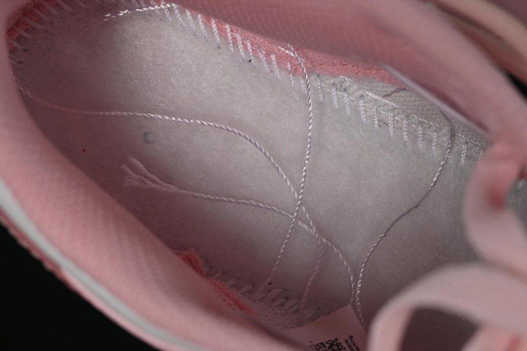 Close-up view inside the pink-lined sneaker.