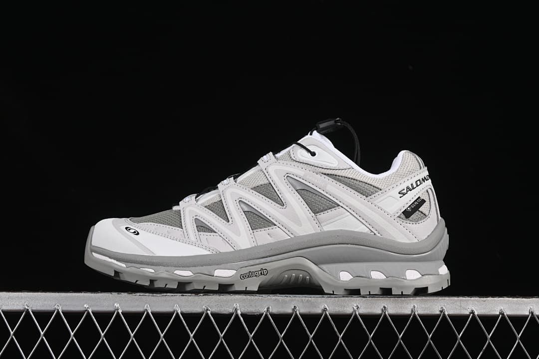 Side view of gray and white Salomon XT-Quest GTX sneakers