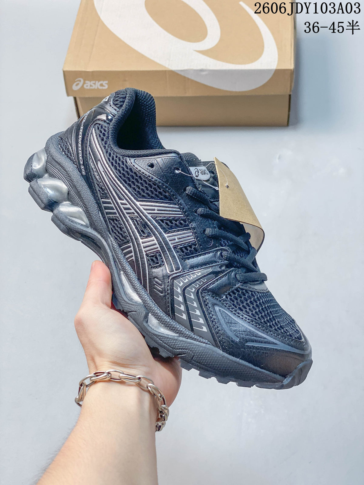 Dark navy ASICS GEL-KAYANO 14 sneaker with silver detailing