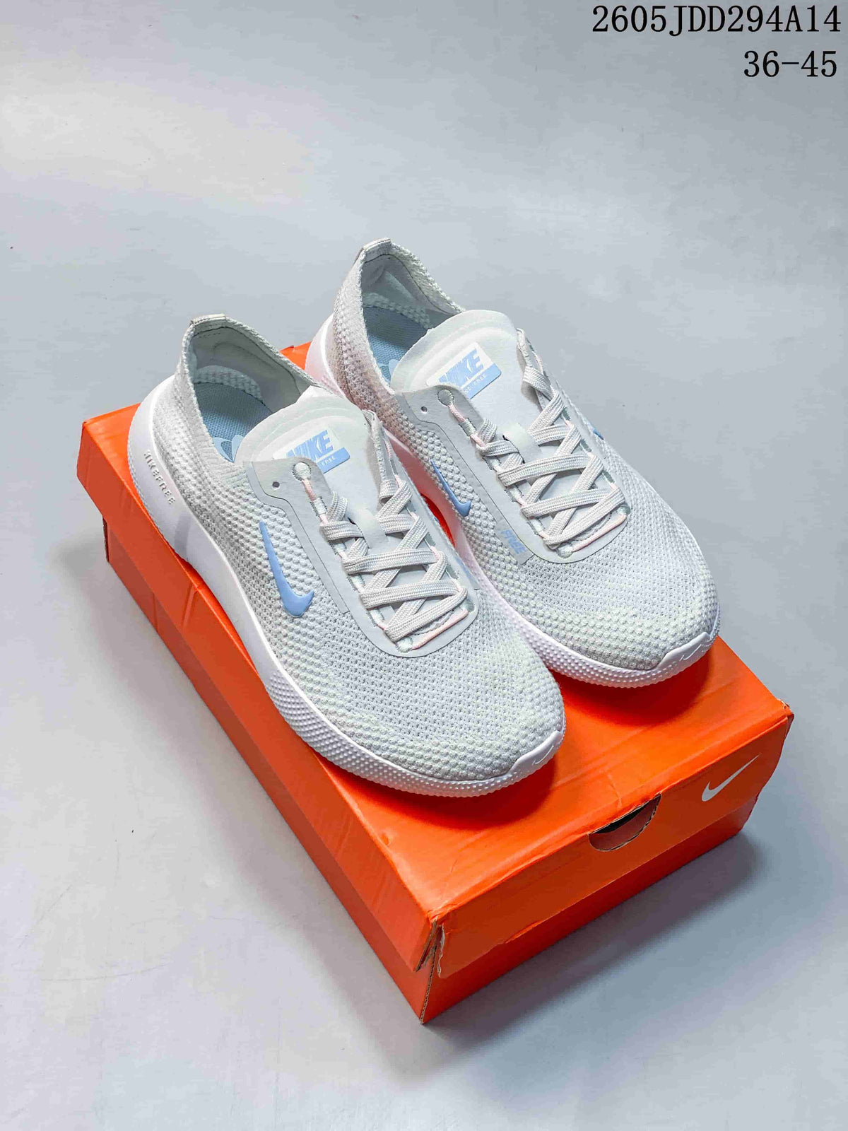 Pair of light gray Nike Free 2025 low-top shoes with blue accents on an orange shoe box