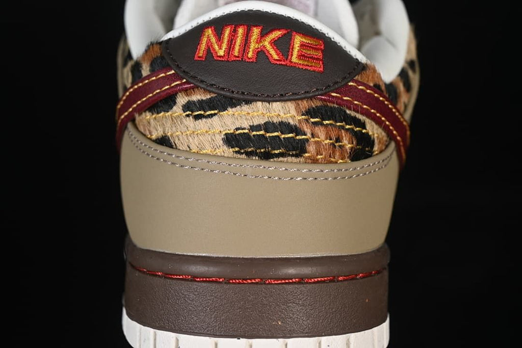 Rear view showing leopard-print heel panels, olive overlays and burgundy stitching