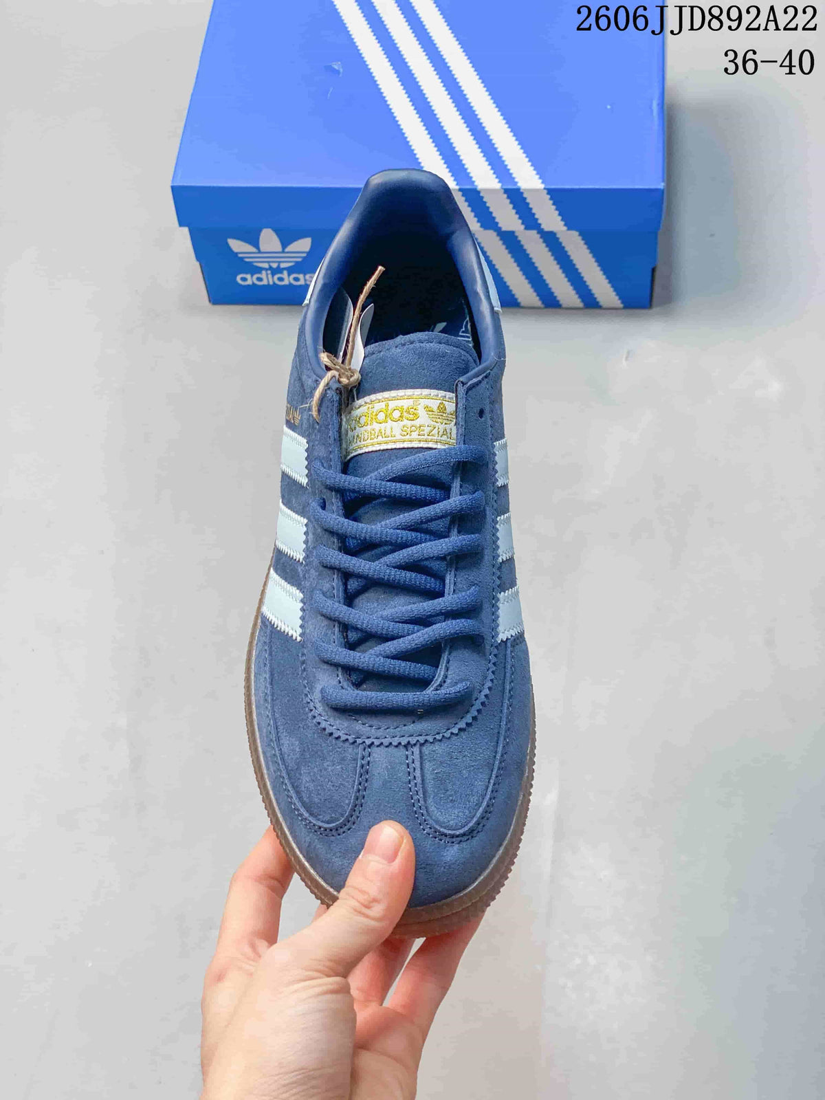 Top view of a blue low-top sneaker with blue laces