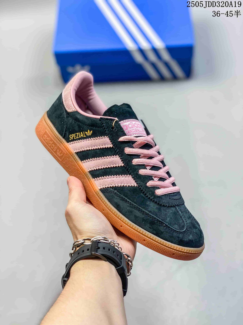 Angled side view showing the pink stripes, pink laces, gum sole and Spezial side marking