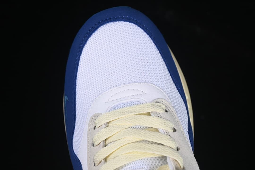Top-down close-up of the mesh toe and cream laces