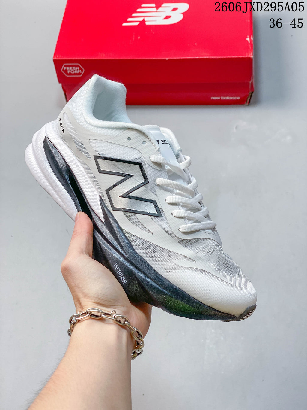 Group of New Balance low-top running shoes in several color combinations, viewed from above.