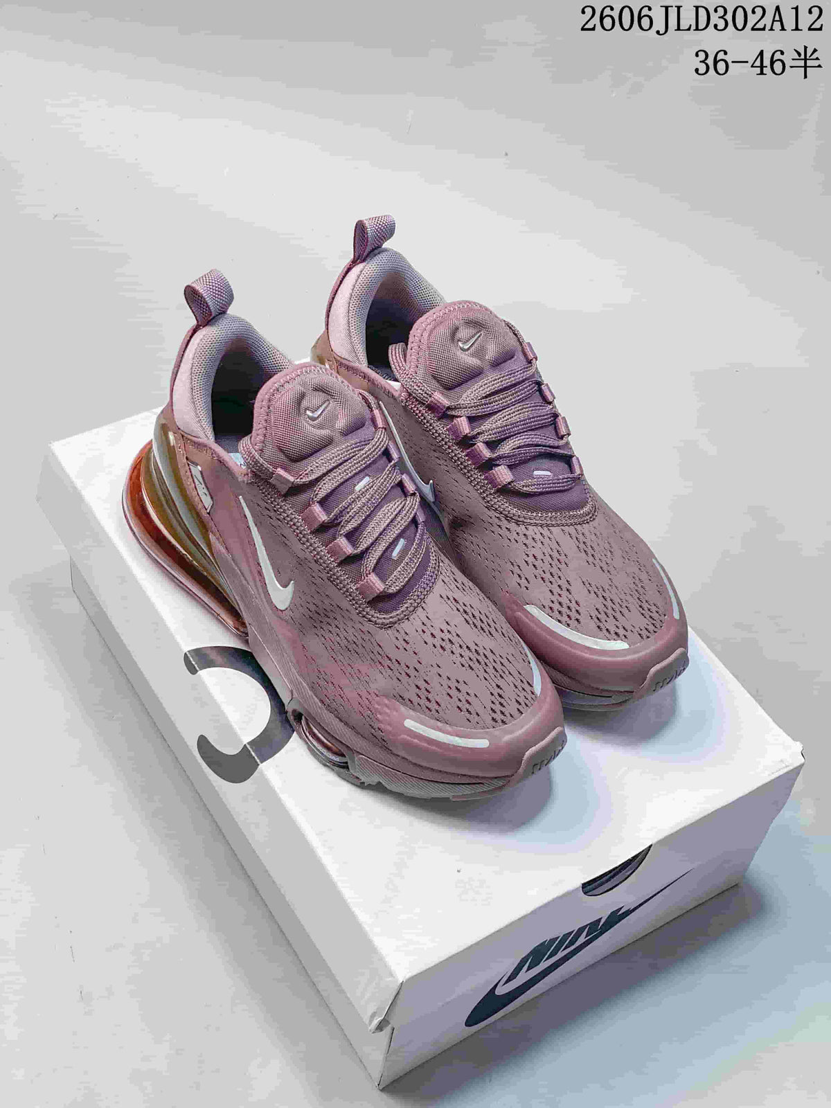 Pair of mauve Nike Air Max 270 sneakers displayed on a shoebox