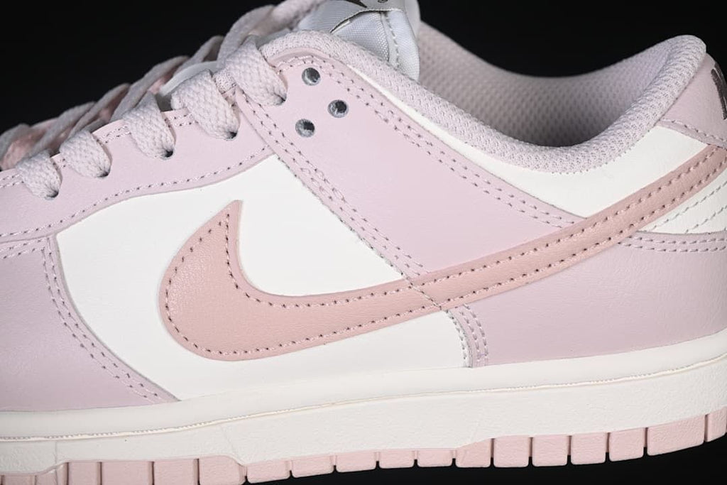 Close-up of the pink side Swoosh and layered panels