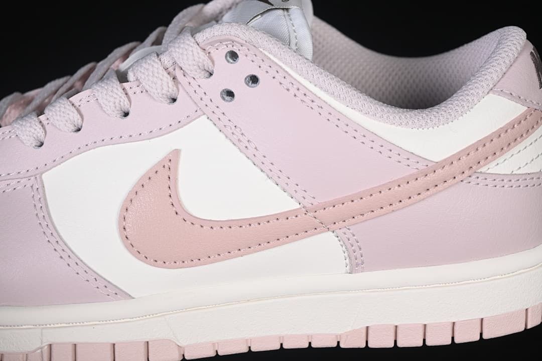 Close-up of the pink side Swoosh and layered panels