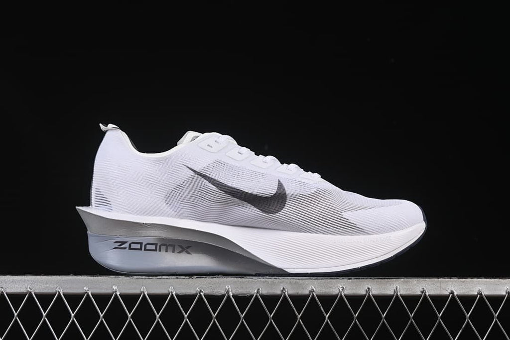 Side profile showing the ZoomX marking, dark Swoosh, and raised midsole shape.