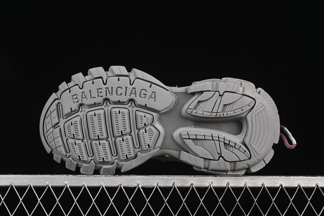 Underside of the sneaker showing the lugged outsole pattern