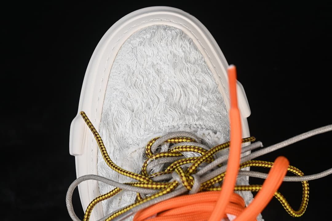 Top-down view of the textured toe and several contrasting laces.