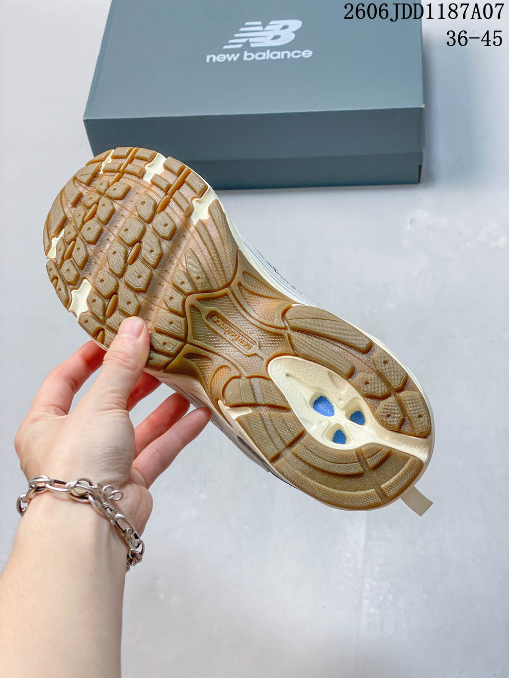 Close-up of the sneaker outsole showing a gum-colored tread pattern.