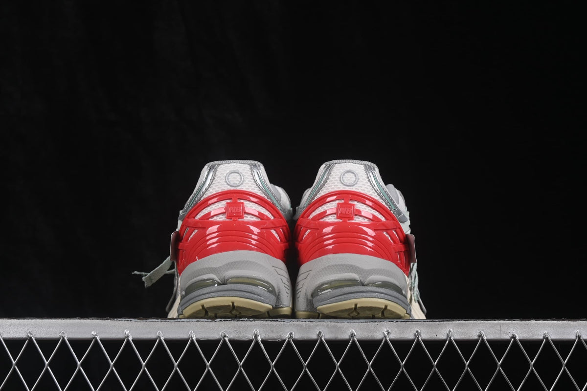 Rear view highlighting the red heel structures and exposed cushioning elements.