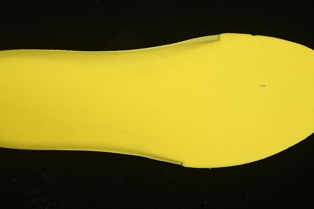 Yellow shoe insert shown from above.