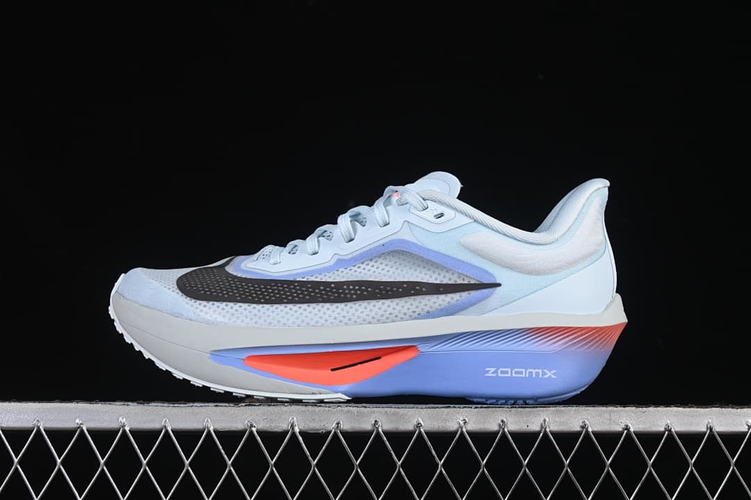 Side profile of Nike Zoom Fly 6 in a light blue, white, violet, coral, and black colorway.