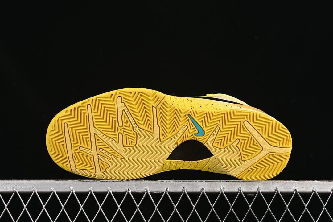 Underside showing the yellow patterned outsole