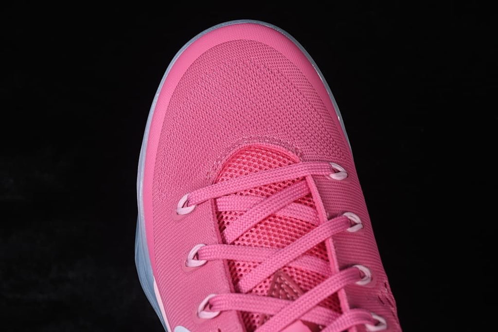 Top view of the pink shoe's toe and lace area