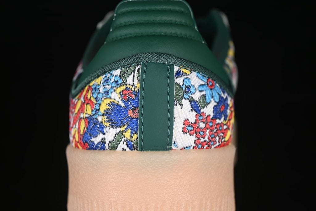 Rear view highlighting the green heel and multicolored floral-patterned panels.