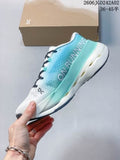 Side view of turquoise and white ON Cloudboom Max sneakers held in front of a shoe box, with the style code and EU size range visible above.