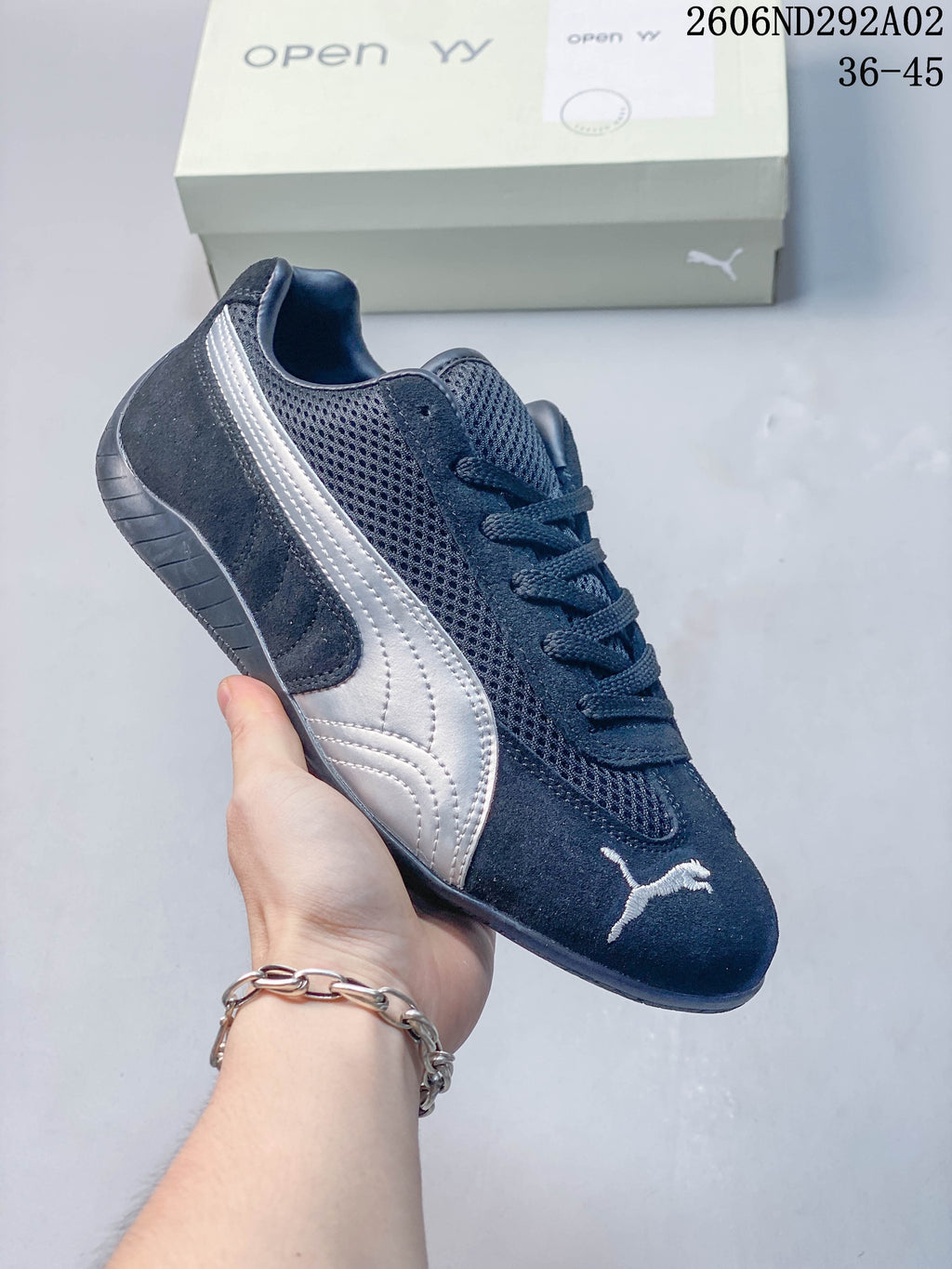 Navy Puma Speedcat The Open YY sneaker with a dark mesh-look panel and pale side stripe