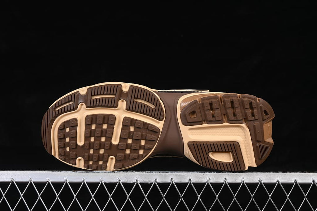 Underside view showing the patterned brown and beige outsole