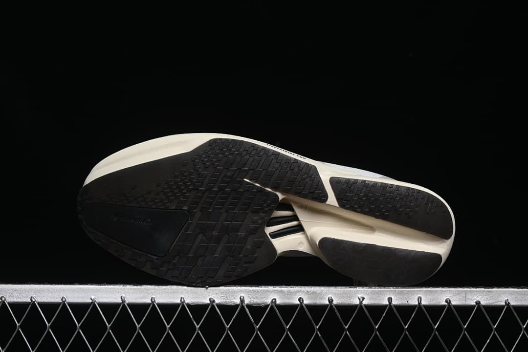 Underside view showing the black outsole and segmented tread