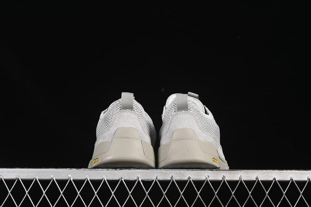 Rear view of the pair showing heel pull tabs and outsole edges.